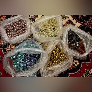 Bulk of handmade beaded blooms for projects
